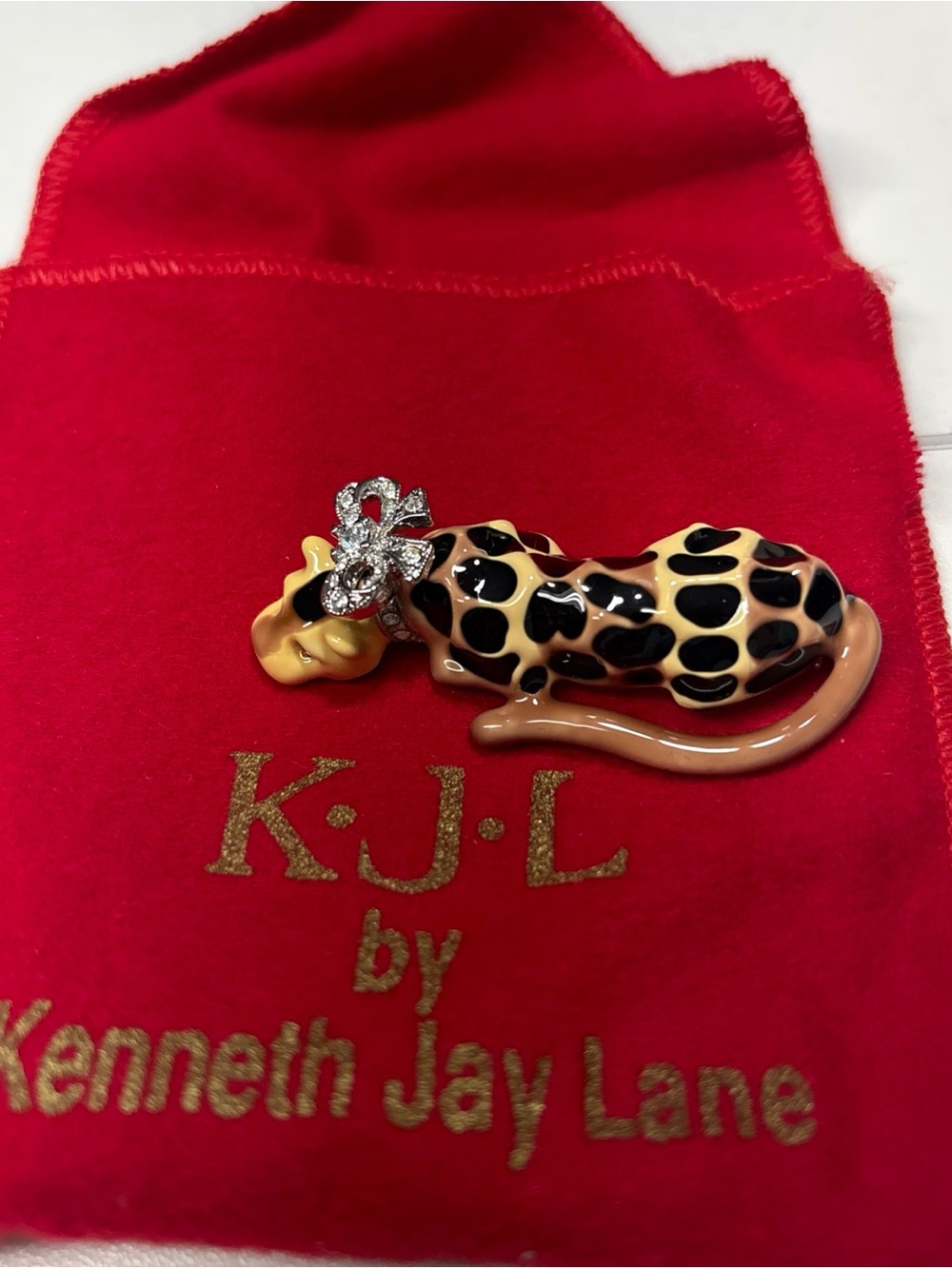 Kenneth Jay Lane Enamel Leopard Cat Brooch in Black and Tan with Rhinestone Bow